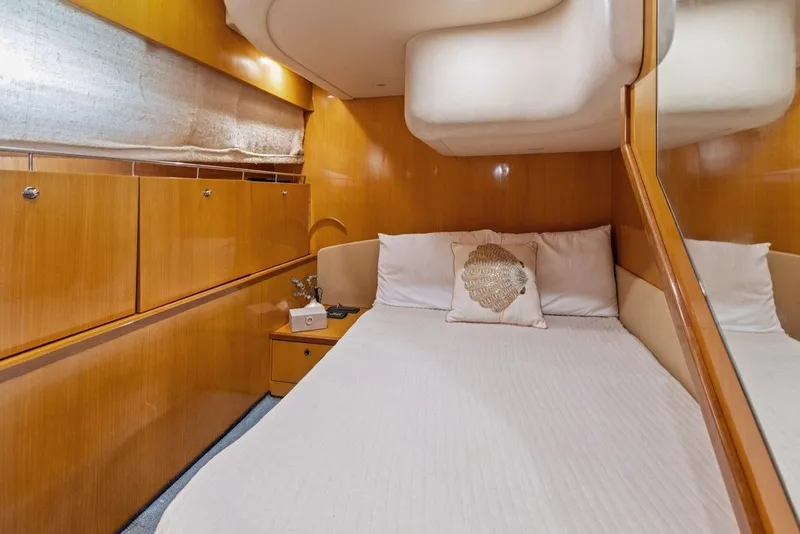 Slide: The Image of Luxurious cabin interior of 2005 Uniesse 54 Sport yacht with cozy bedding. - 16