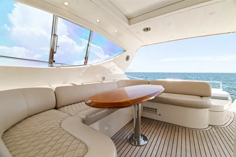Slide: The Image of Luxurious seating area on a 2005 Uniesse 54 Sport yacht with ocean view. - 22