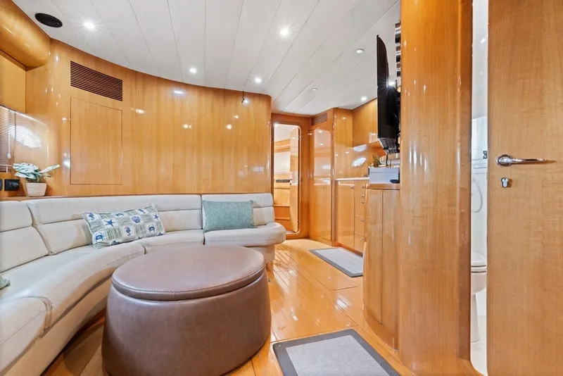 Slide: The Image of Luxurious interior of 2005 Uniesse 54 Sport yacht with elegant wood finishes and plush seating. - 12