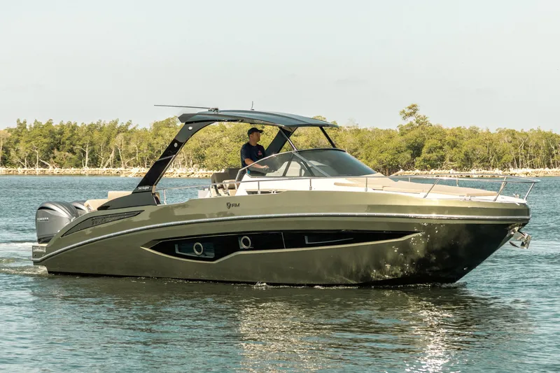 The Image of 2024 FIM 340 REGINA luxury boat cruising on a calm waterway. - 0