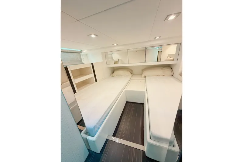 Slide: The Image of 2024 FIM 34 Regina yacht interior with twin beds and modern design. - 25
