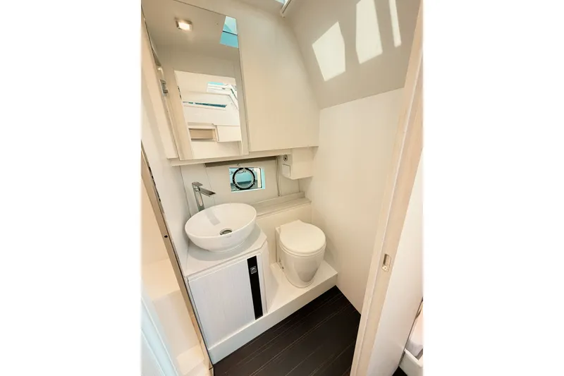 Slide: The Image of Modern bathroom interior on 2024 FIM 34 Regina yacht, featuring sleek design and compact fixtures. - 26