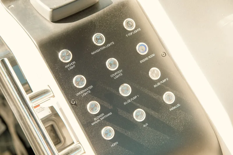 Slide: The Image of Control panel of 2024 FIM 34 Regina boat with labeled buttons for various functions. - 18
