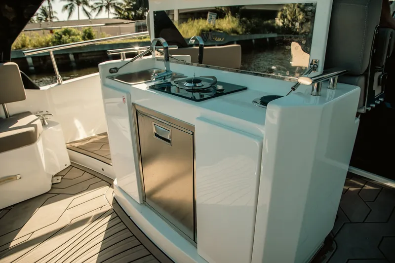 Slide: The Image of Outdoor kitchen on 2024 FIM 34 Regina yacht with stove and sink. - 15