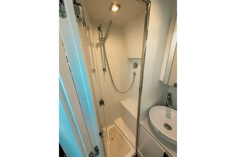 Slide: The Image of Compact modern shower in 2024 FIM 34 Regina yacht bathroom. - 27