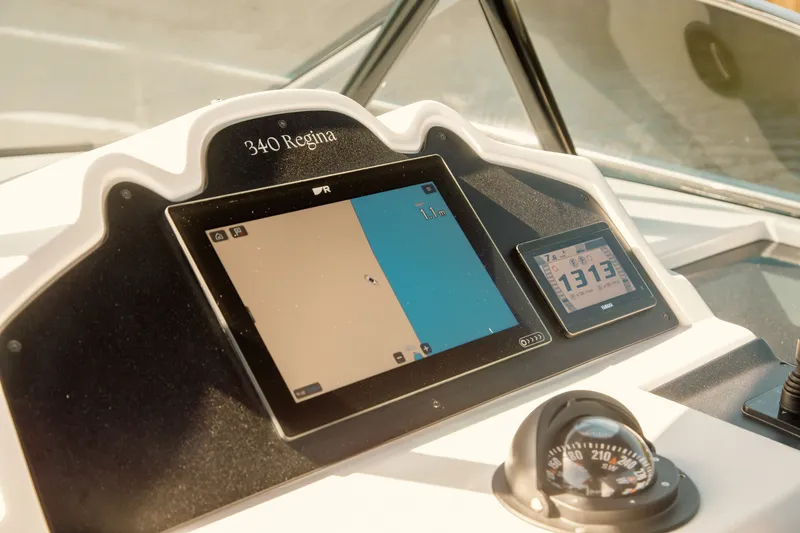 Slide: The Image of Dashboard of 2024 FIM 34 Regina boat with navigation and control displays. - 17