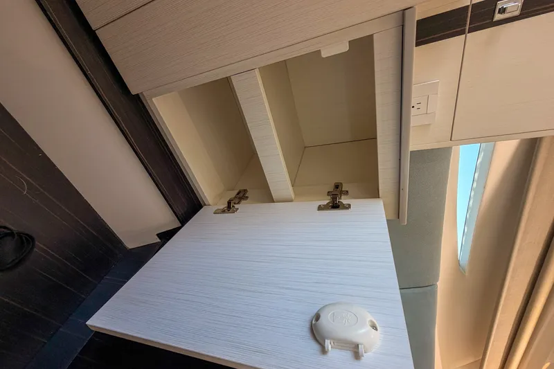 Slide: The Image of Open cabinet in 2024 FIM 34 Regina, showcasing modern interior design. - 23