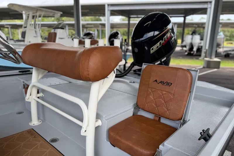 Slide: The Image of Avid 207 Recon boat interior with brown leather seating, 2027 model. - 12
