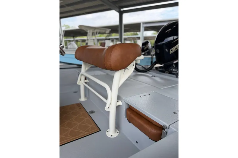 Slide: The Image of Avid 207 Recon 2027 boat interior with brown leather seating and white frame. - 13