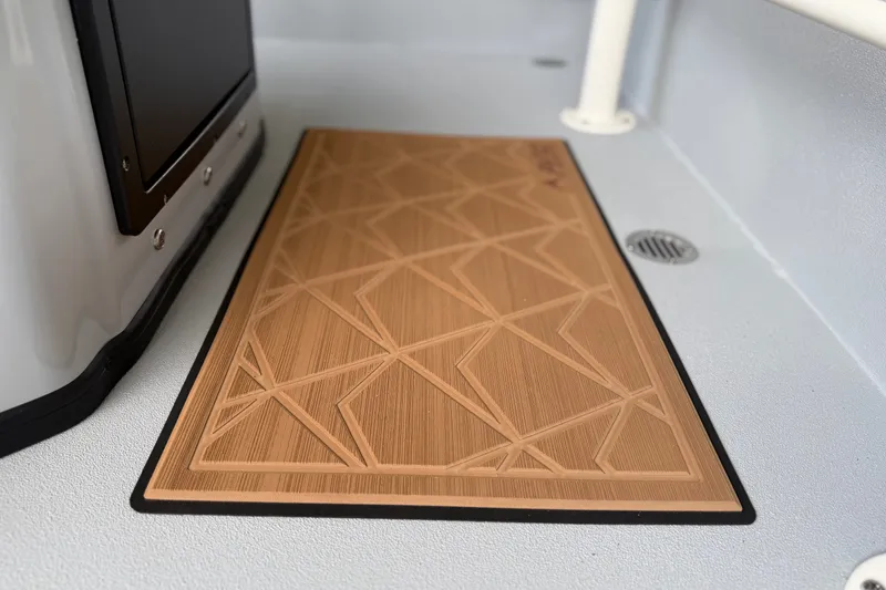 Slide: The Image of Geometric-patterned mat on Avid 207 Recon boat floor, 2027 model. - 9