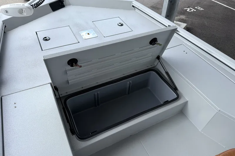 Slide: The Image of Open storage compartment on 2027 Avid 207 Recon boat, showcasing spacious interior design. - 4