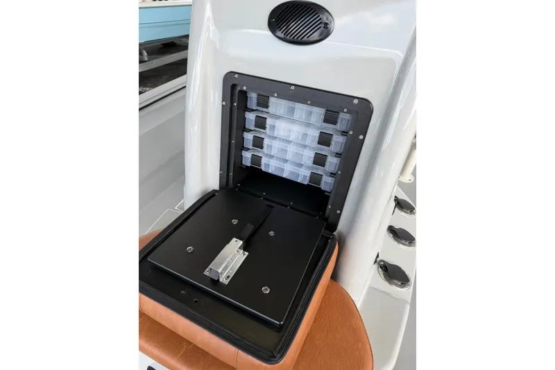 Slide: The Image of Storage compartment with tackle boxes on Avid 207 Recon boat, 2027 model. - 5