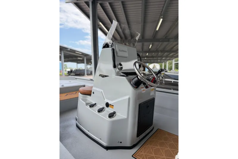 Slide: The Image of Avid 207 Recon 2027 boat console with steering wheel and controls. - 14