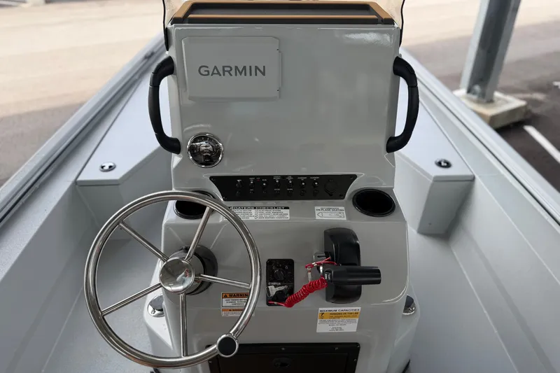 Slide: The Image of Steering console of 2027 Avid 207 Recon boat with Garmin navigation system. - 8