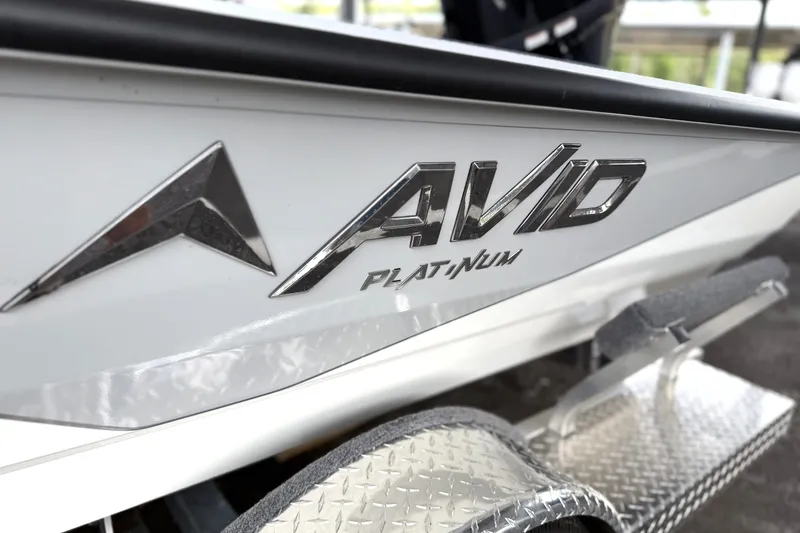 Slide: The Image of Close-up of Avid 207 Recon boat logo, 2027 model, on a metallic surface. - 19