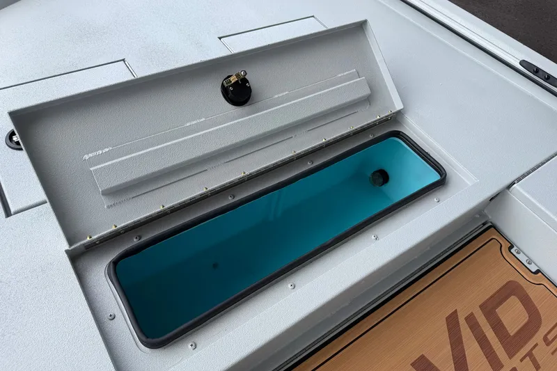 Slide: The Image of Open storage compartment on 2027 Avid 207 Recon boat deck. - 3