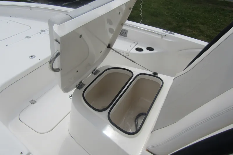 Slide: The Image of Open storage compartment on 2018 ShearWater 260 Carolina Flare boat. - 13