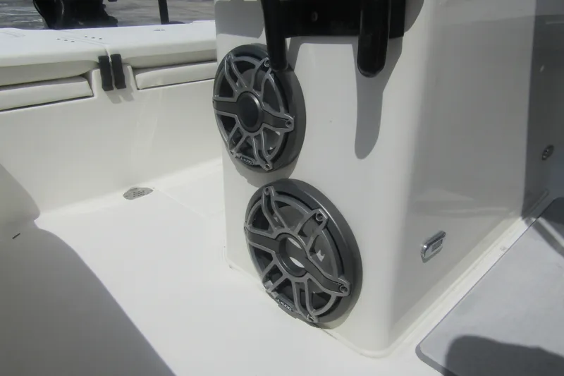 Slide: The Image of 2018 ShearWater 260 Carolina Flare boat speakers on white deck. - 18