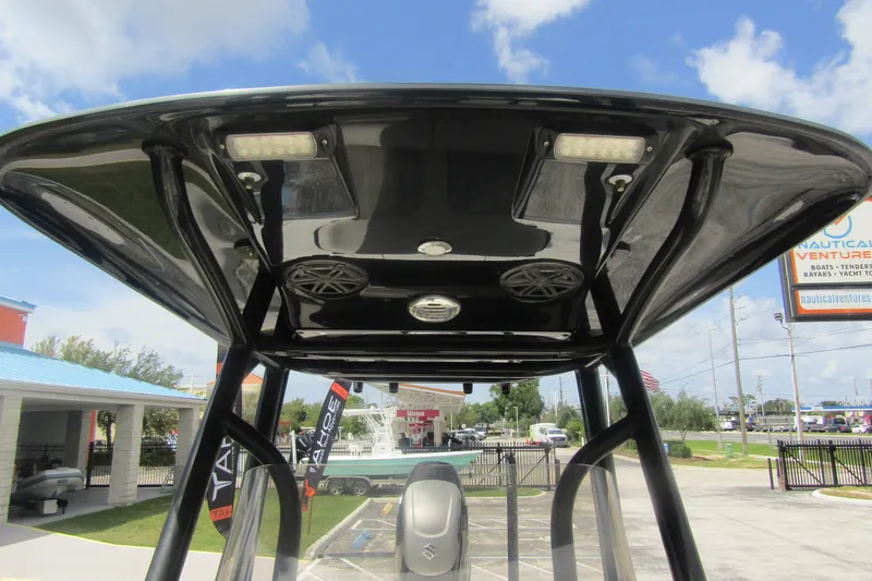 Slide: The Image of T-top view of 2018 ShearWater 260 Carolina Flare boat with speakers and lights. - 17