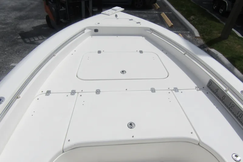 Slide: The Image of 2018 ShearWater 260 Carolina Flare boat deck, featuring storage compartments and sleek design. - 14
