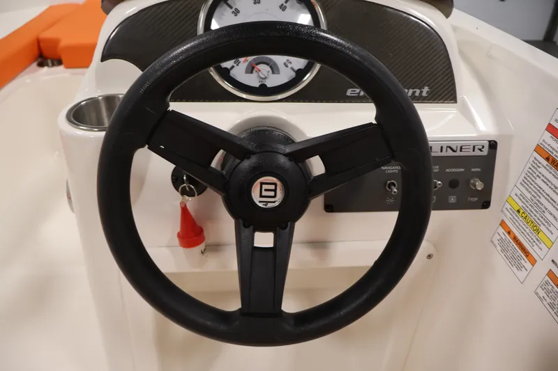 Slide: The Image of 2019 Bayliner Element 180 XL dashboard with steering wheel and instrument panel. - 18