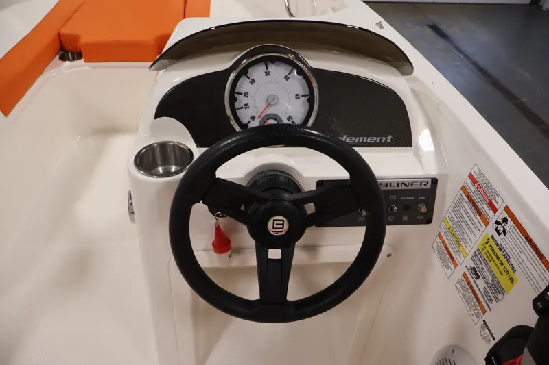 Slide: The Image of 2019 Bayliner Element 180 XL boat dashboard with steering wheel and gauges. - 17