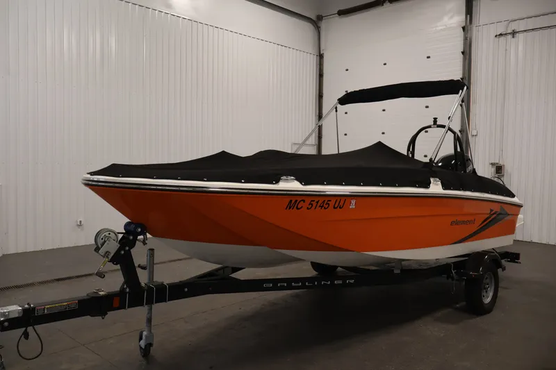 Slide: The Image of 2019 Bayliner Element 180 XL boat with cover on trailer in indoor storage. - 42
