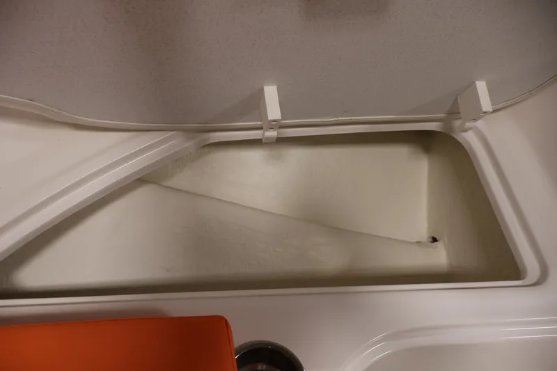 Slide: The Image of Open storage compartment in 2019 Bayliner Element 180 XL boat interior. - 15