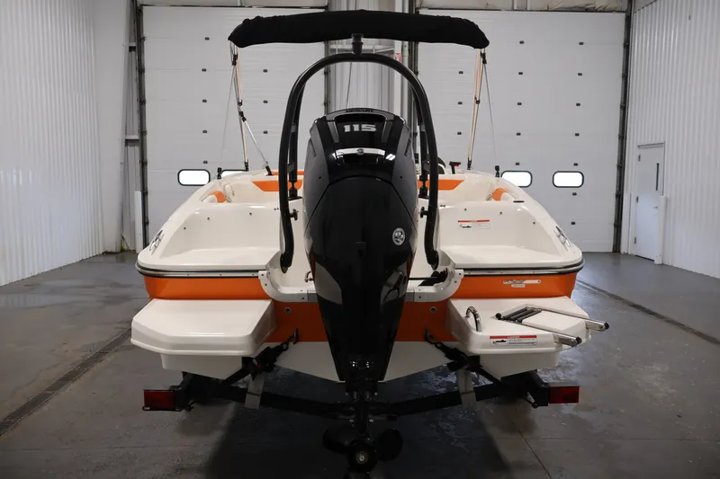 Slide: The Image of 2019 Bayliner Element 180 XL boat with outboard motor in a garage setting. - 6
