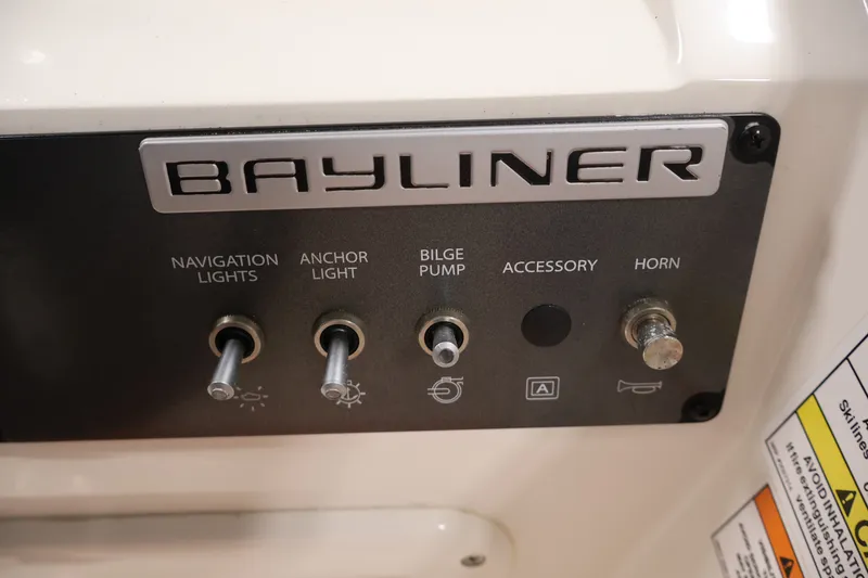 Slide: The Image of Control panel of a 2019 Bayliner Element 180 XL boat with labeled switches. - 20