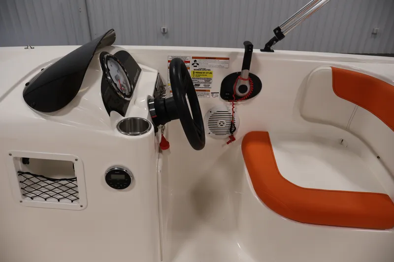 Slide: The Image of 2019 Bayliner Element 180 XL boat interior with steering wheel and orange seating. - 16