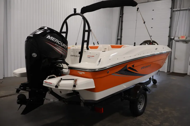 Slide: The Image of 2019 Bayliner Element 180 XL boat with Mercury outboard engine in a garage. - 5