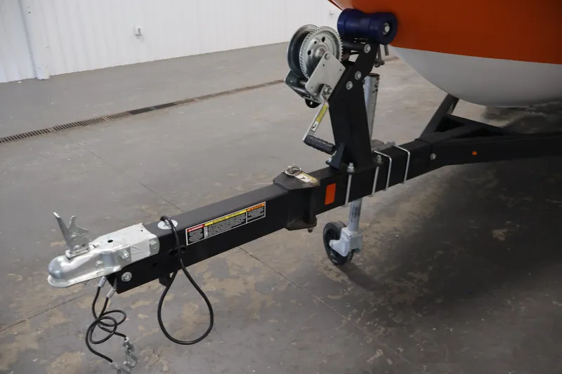 Slide: The Image of Trailer hitch of a 2019 Bayliner Element 180 XL boat in a garage setting. - 37
