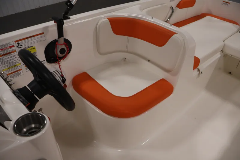 Slide: The Image of 2019 Bayliner Element 180 XL boat interior with orange and white seating. - 24