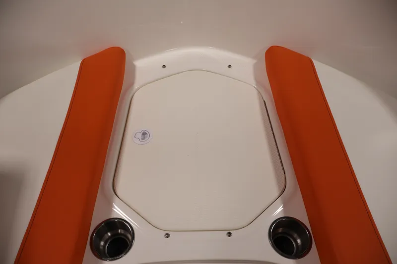Slide: The Image of 2019 Bayliner Element 180 XL boat interior with orange seating and cup holders. - 10