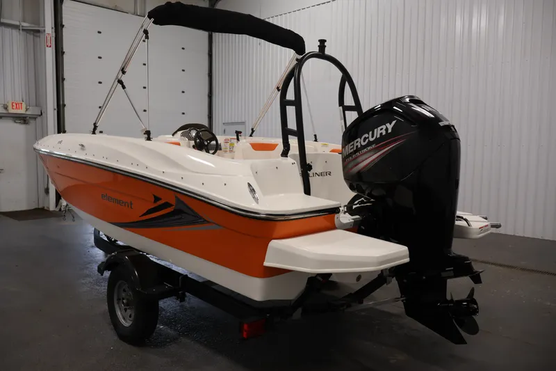Slide: The Image of 2019 Bayliner Element 180 XL boat with Mercury outboard motor in indoor setting. - 7