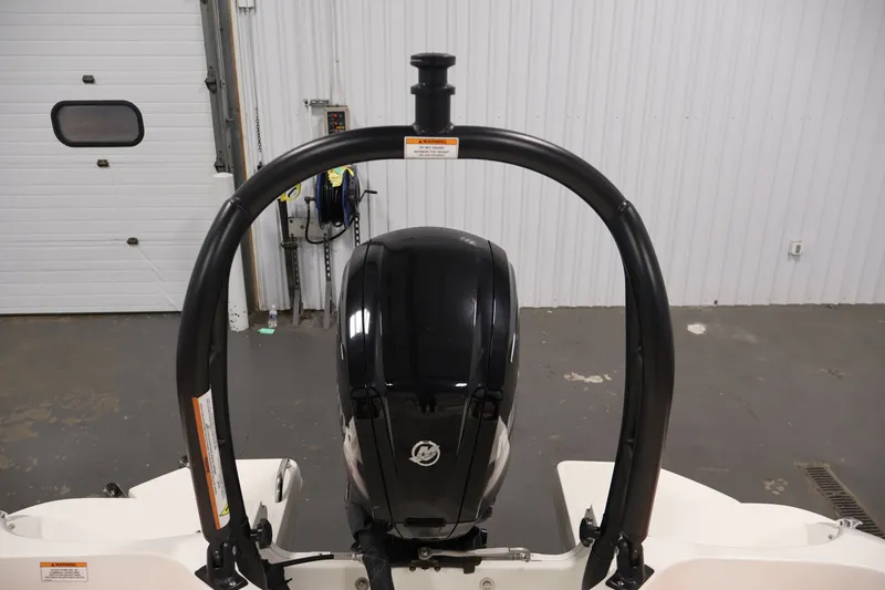 Slide: The Image of 2019 Bayliner Element 180 XL boat engine in a garage setting. - 32