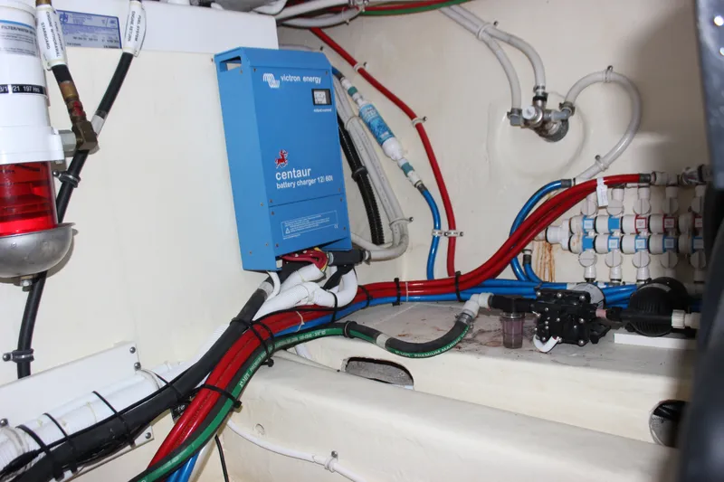 Slide: The Image of Engine room of 2019 Tiara Yachts C39 Coupe with battery charger and wiring. - 44