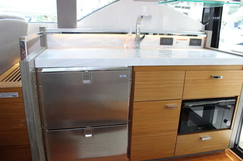 Slide: The Image of Modern kitchen area in 2019 Tiara Yachts C39 Coupe with stainless steel appliances. - 68