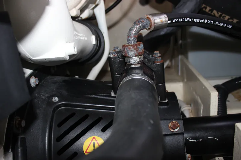 Slide: The Image of Engine compartment of a 2019 Tiara Yachts C39 Coupe, showing hoses and fittings. - 53