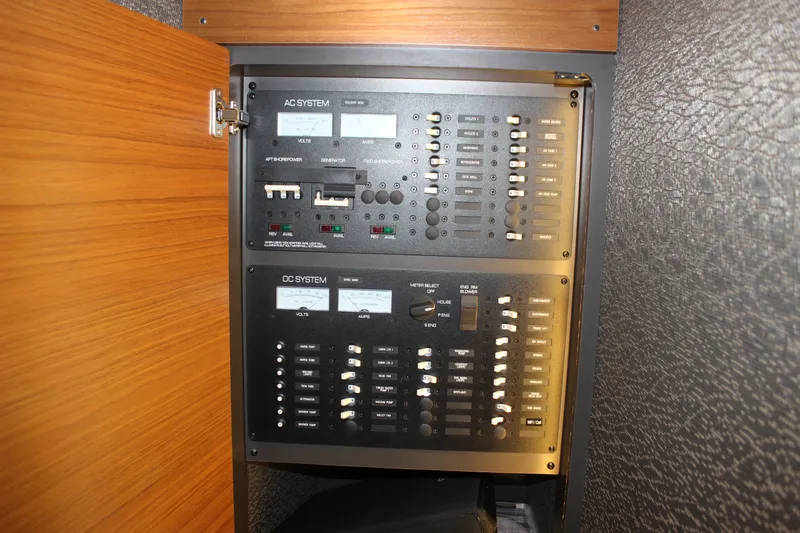 Slide: The Image of Electrical panel of 2019 Tiara Yachts C39 Coupe, showcasing AC and DC systems. - 84