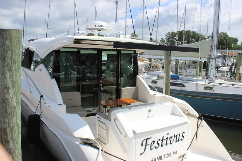 Slide: The Image of 2019 Tiara Yachts C39 Coupe docked, featuring sleek design and spacious deck area. - 31