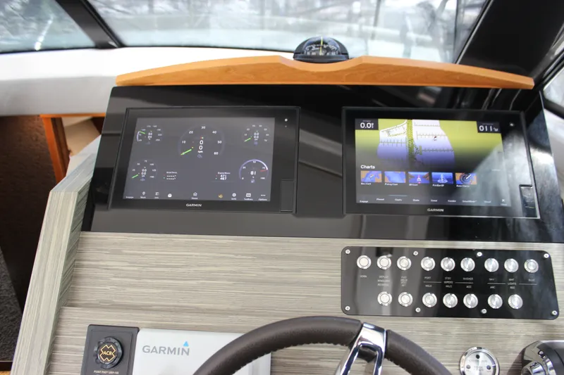 Slide: The Image of Dashboard of 2019 Tiara Yachts C39 Coupe with Garmin navigation displays. - 99