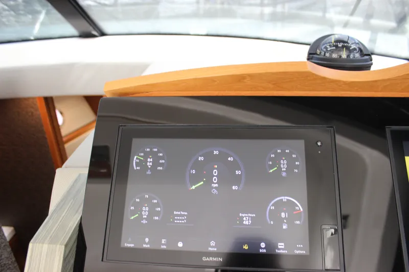 Slide: The Image of Dashboard of 2019 Tiara Yachts C39 Coupe with Garmin display and compass. - 97