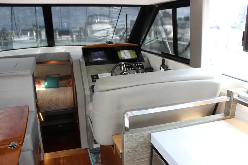 Slide: The Image of 2019 Tiara Yachts C39 Coupe interior with helm, cabin, and navigation equipment. - 64