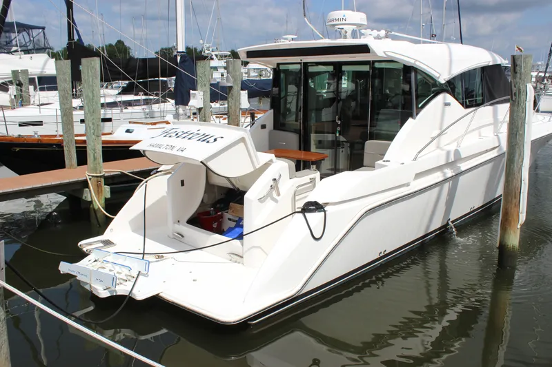 Slide: The Image of 2019 Tiara Yachts C39 Coupe docked at marina, showcasing sleek design and modern features. - 18