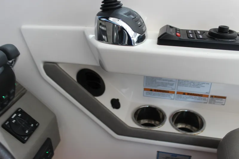 Slide: The Image of Control panel of 2019 Tiara Yachts C39 Coupe with joystick and cup holders. - 25