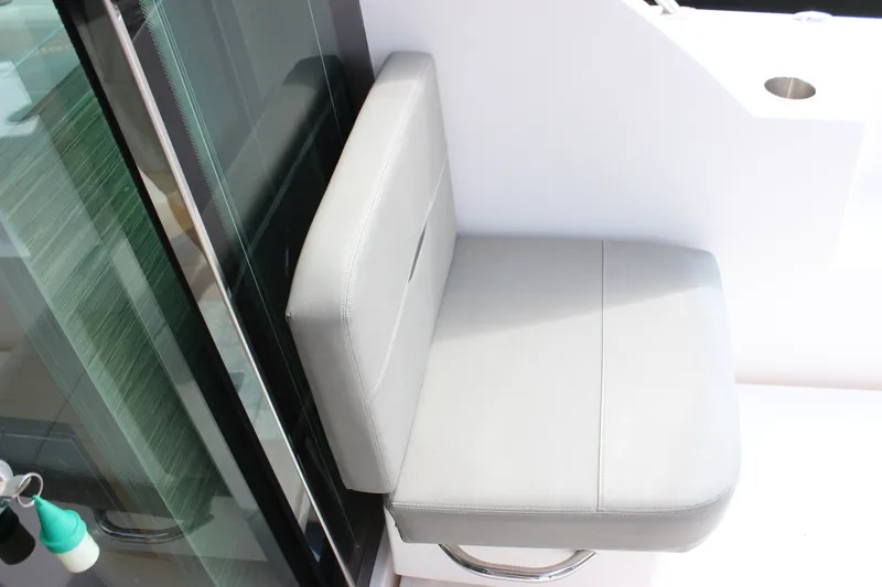 Slide: The Image of Gray cushioned seat on 2019 Tiara Yachts C39 Coupe, near glass door. - 20