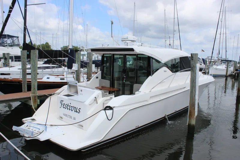 The Image of 2019 Tiara Yachts C39 Coupe docked at marina, rear view. - 3
