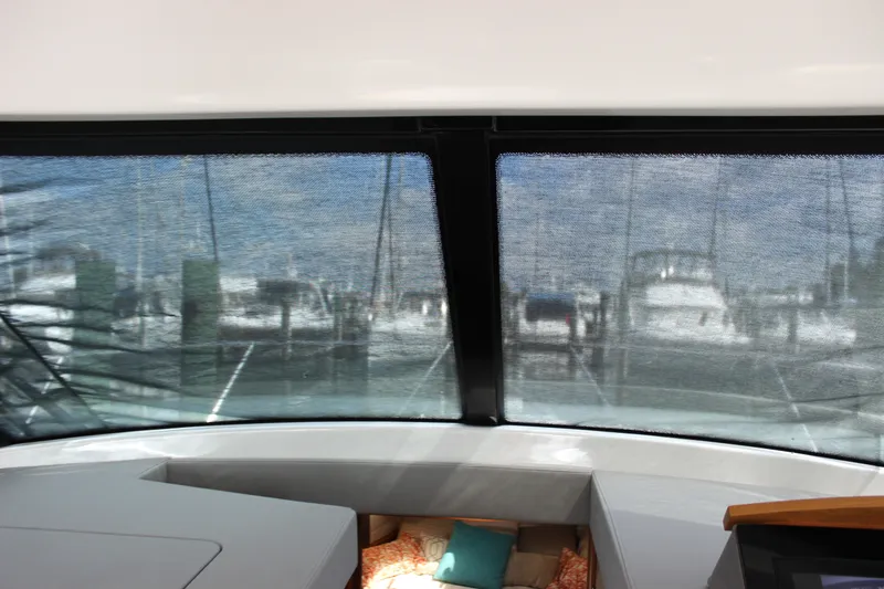 Slide: The Image of Interior view from 2019 Tiara Yachts C39 Coupe, showcasing marina through windshield. - 74